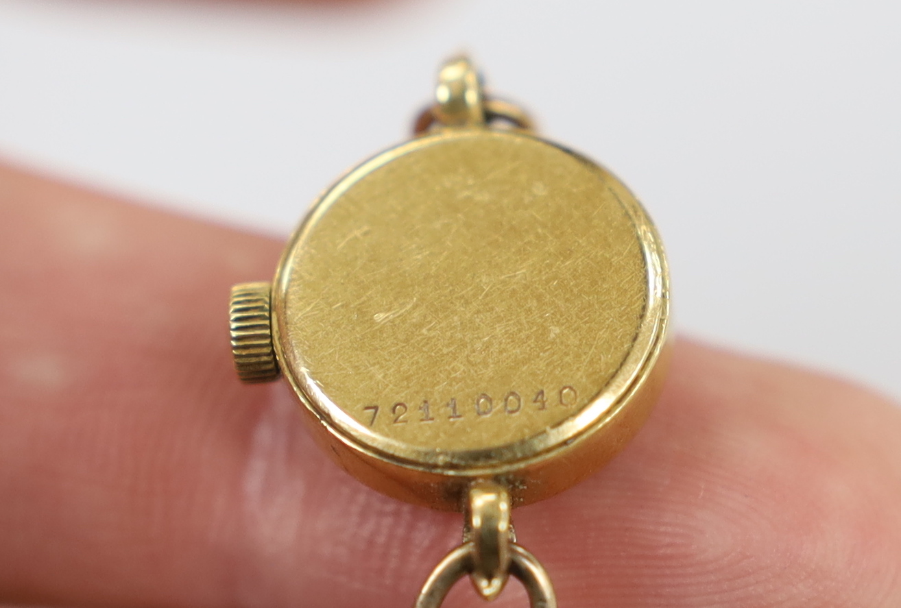 A lady's yellow metal Girard Perregaux manual wind wrist watch, on a 9ct twin strand bracelet, gross weight 12.6 grams, with Girard Perregaux box.